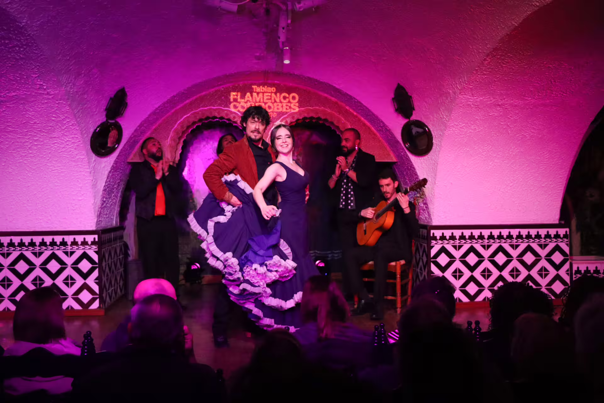 Dynamic Flamenco duo captivates audience at Tablao Cordobes, showcasing passionate dance and live guitar in Barcelona.