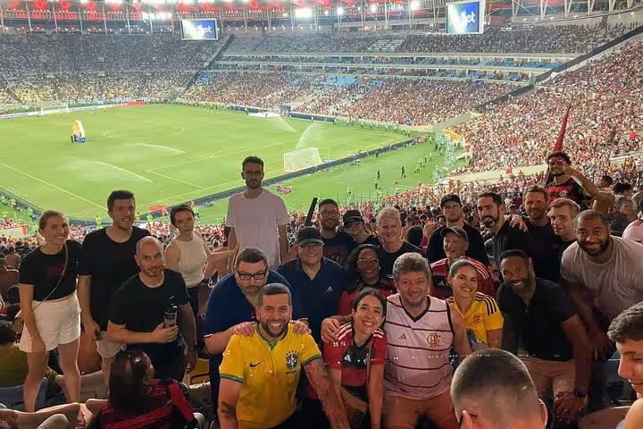 Tour group photo at Maracanã Stadium before a Flamengo game, Rio de Janeiro football matchday atmosphere