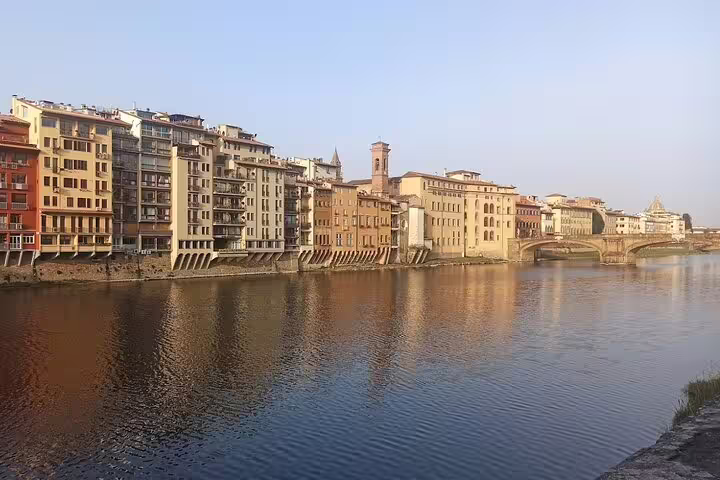 Riverside view of historic Florence palaces along the Arno, seen on a private shore excursion from Livorno to Chianti
