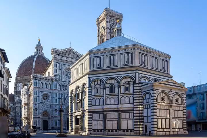 Close-up of Florence Cathedral and Baptistery, featured in the Rome to Florence day trip with Uffizi Gallery tickets.