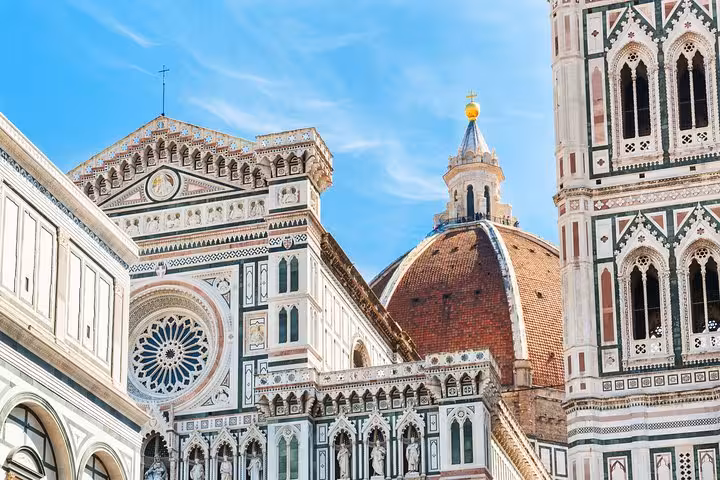 Marvel at Florence's stunning Florence Cathedral with its intricate facade and iconic dome on our Livorno to Florence tour.