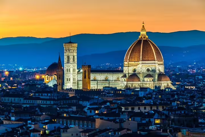 Stunning sunset view of Florence's iconic cathedral, perfect for a private airport transfer starting in the city.
