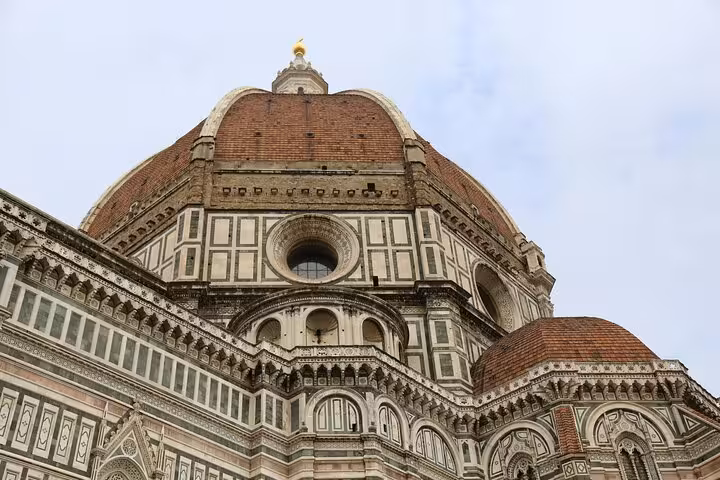 Close-up of Florence's iconic Duomo, showcasing intricate architectural details on a Rome to Florence day trip.