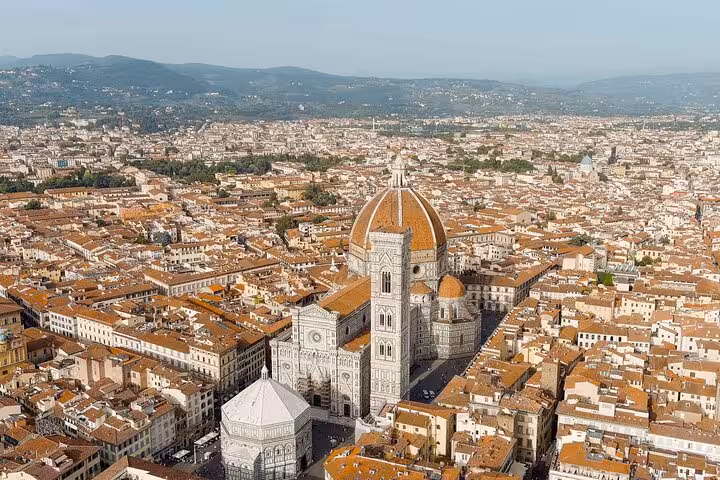 Aerial view of Florence showcasing the iconic Duomo Cathedral, a highlight of the Rome to Florence day trip tour.