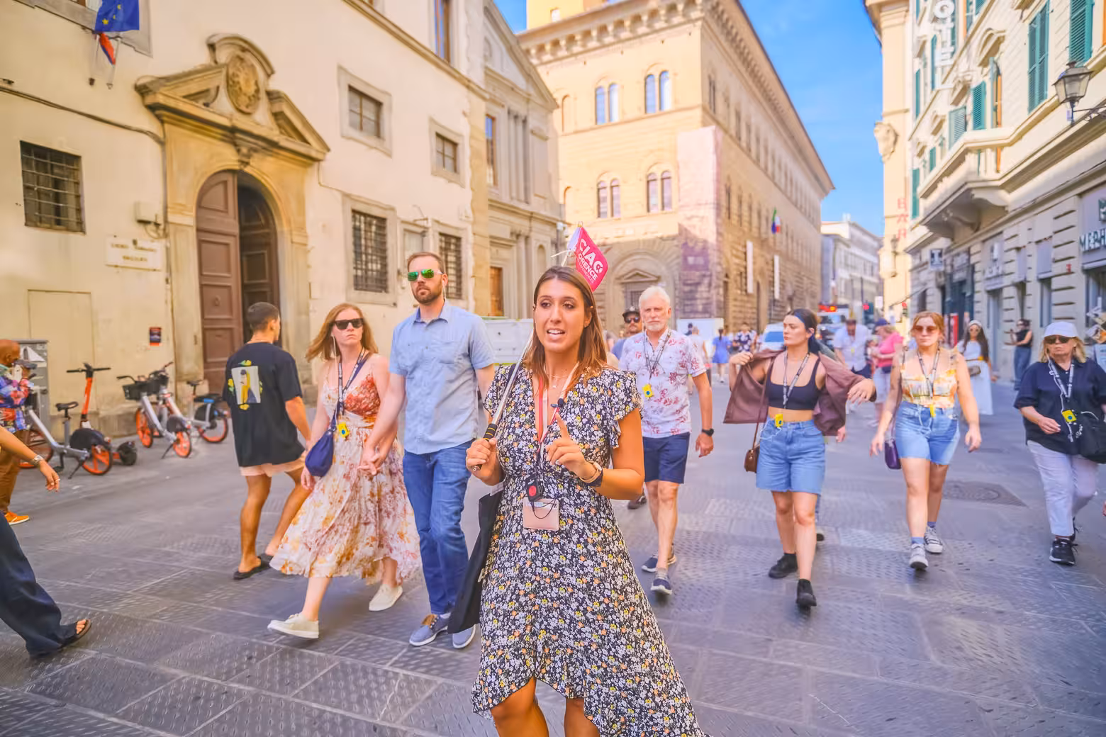A guided tour group walks through historic Florence, discovering the hidden terraces of the iconic Duomo Complex.