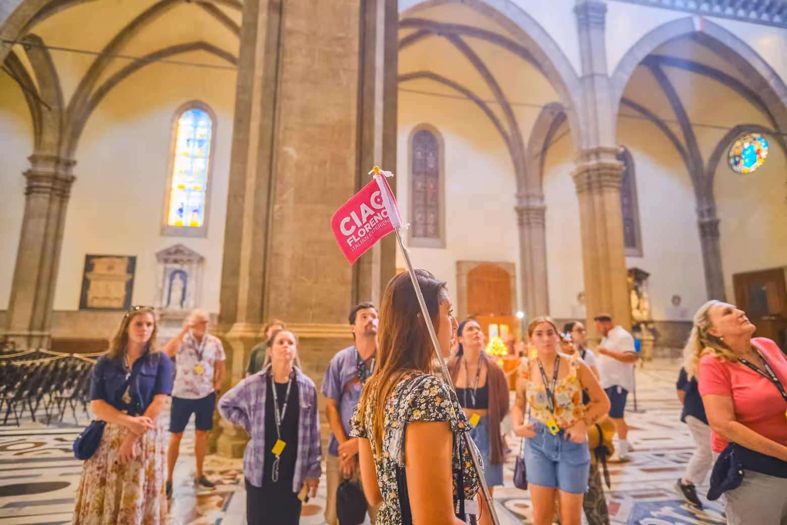 Visitors captivated by the grandeur of Florence's Duomo interior during a guided tour.