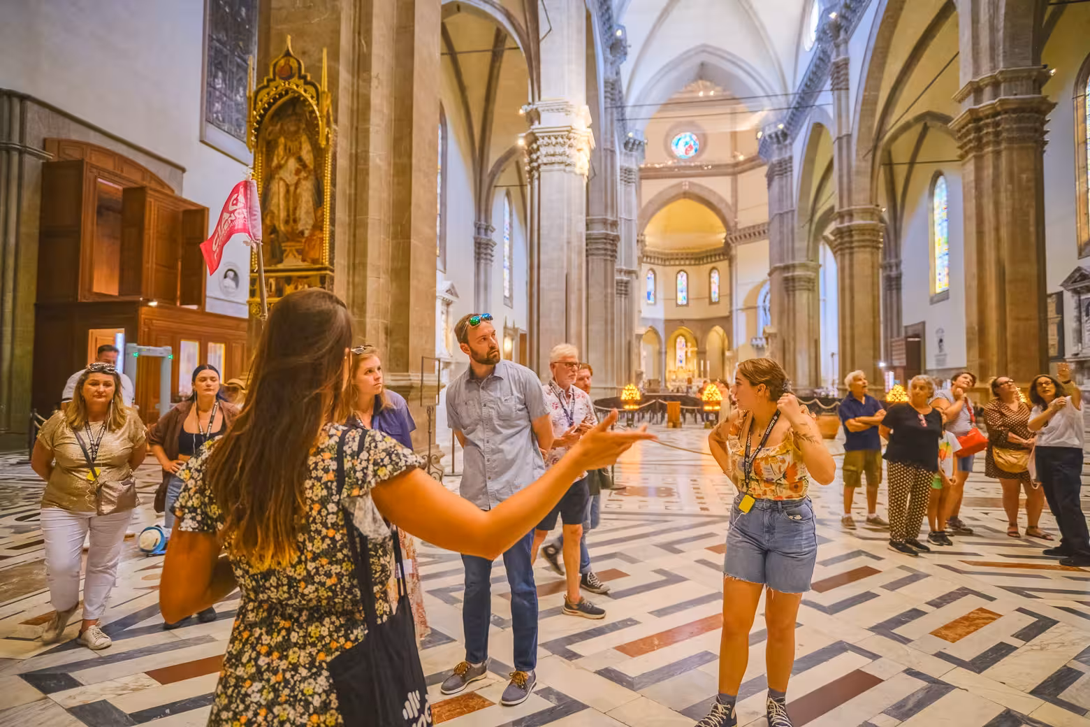 Tour group exploring the stunning interior of Florence's Duomo with an expert guide.