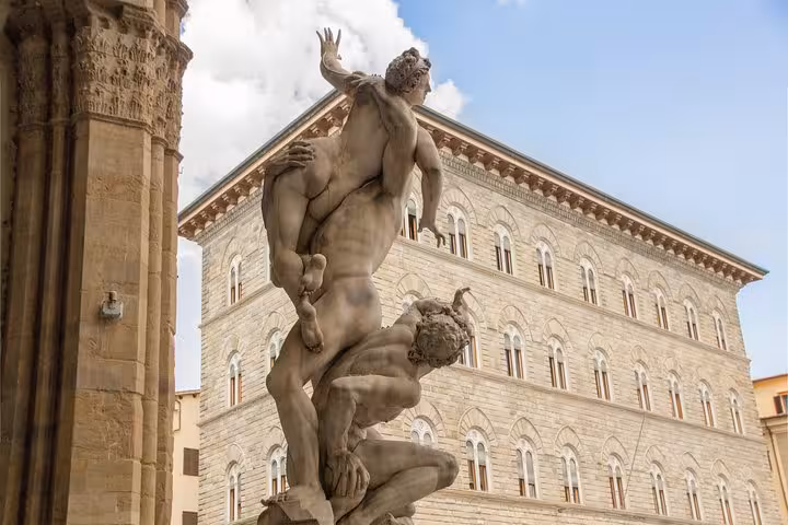 Dramatic marble sculpture in Florence's Piazza della Signoria, showcasing Renaissance art on Accademia & Uffizi tour.