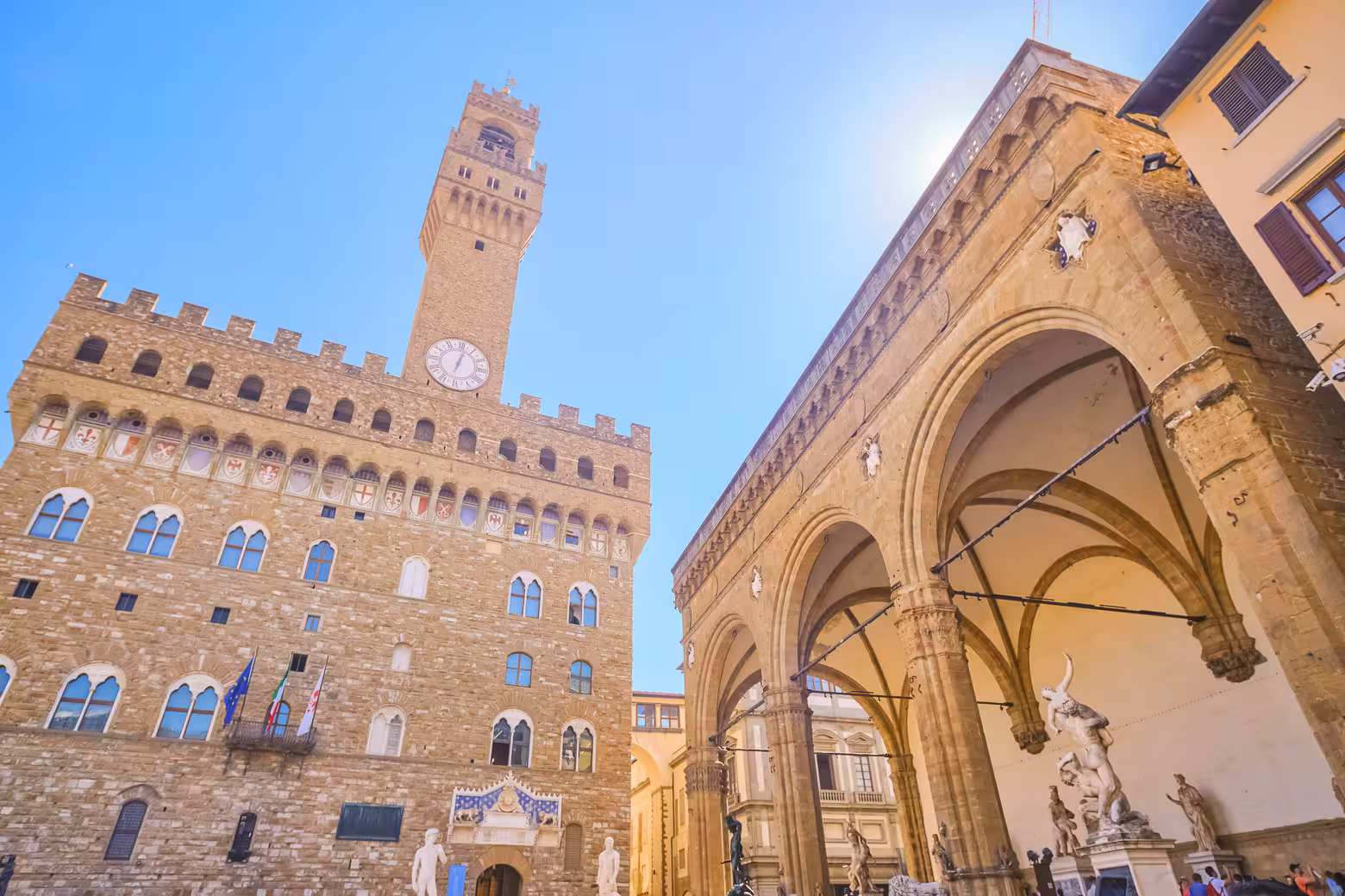 Discover the iconic Palazzo Vecchio and Loggia dei Lanzi bathed in sunlight in Florence on a full day shore excursion.