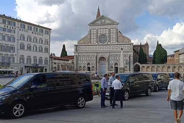 Private vans waiting by Basilica of Santa Maria Novella in Florence at the start of a Florence and Pisa day tour from La Spezia