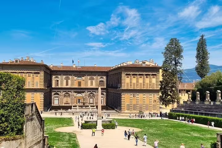 Explore the grandeur of Florence's Pitti Palace with its stunning architecture and lush gardens on a captivating four-hour tour.