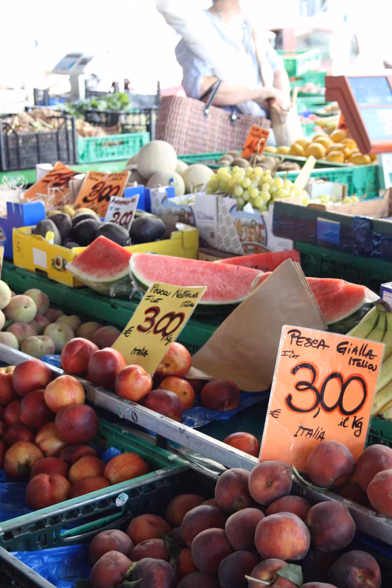 Fresh fruit stall at Florence Sant’Ambrogio Market with peaches and watermelon on a Cibreino tasting walk