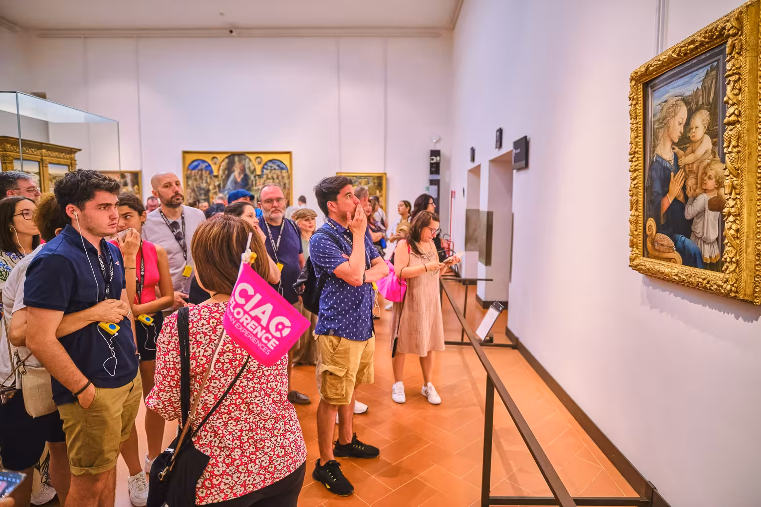Visitors admire Renaissance art during a guided tour of Florence's Uffizi Gallery.