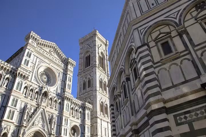 Marvel at the stunning architecture of Florence's cathedral during the Wine Windows Walk with wine tasting.