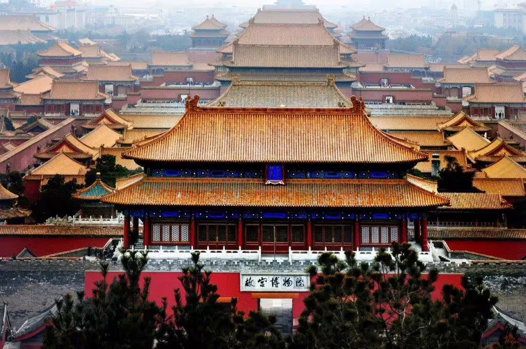 Aerial view of the Forbidden City in Beijing, showcasing traditional Chinese architecture and imperial grandeur.