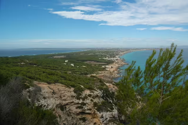 Rocky Ibiza cliffs and blue sea panorama, scenic photo from Ibiza bus tour with fast ferry and official guide