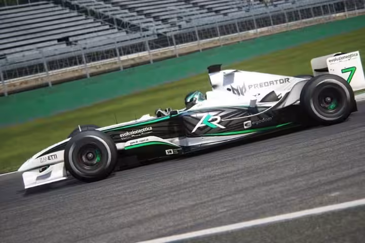 Formula-style race car on track, representing 30' simulator session with realistic single-seater motorsport driving