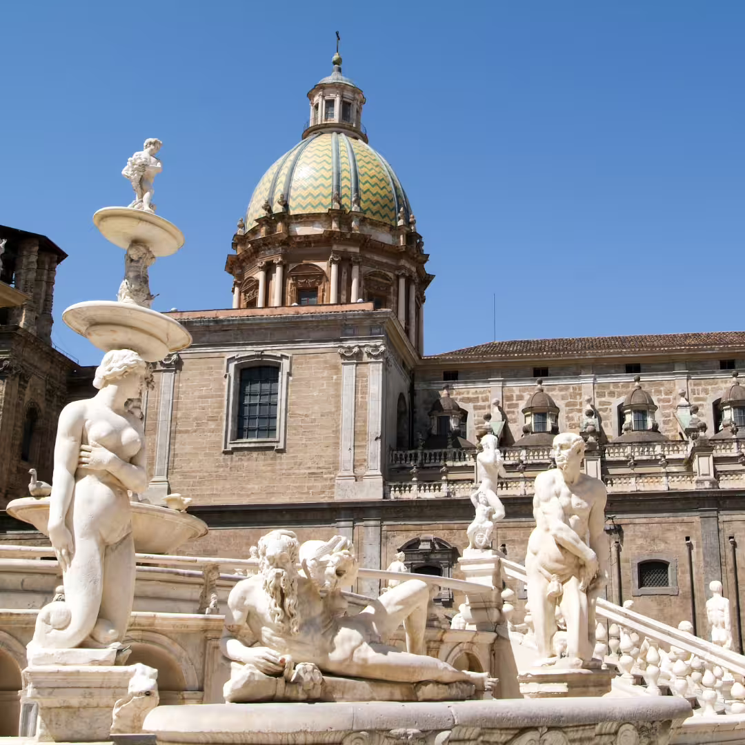 Fountain of Shame statues and historic dome at Piazza Pretoria in Palermo, a highlight of private Monreale and city tours