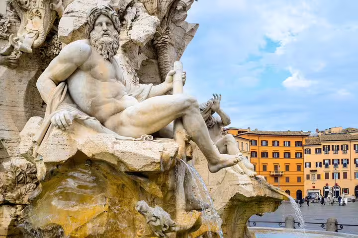 Detail of the Four Rivers Fountain statue in Piazza Navona, Rome, a highlight of the Famous Squares and Fountains tour