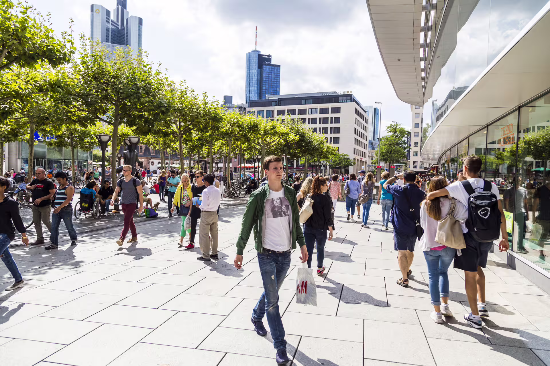 Crowds at Zeil shopping street in Frankfurt city center, key scene on a 1-day walking tour with 7-language audioguide
