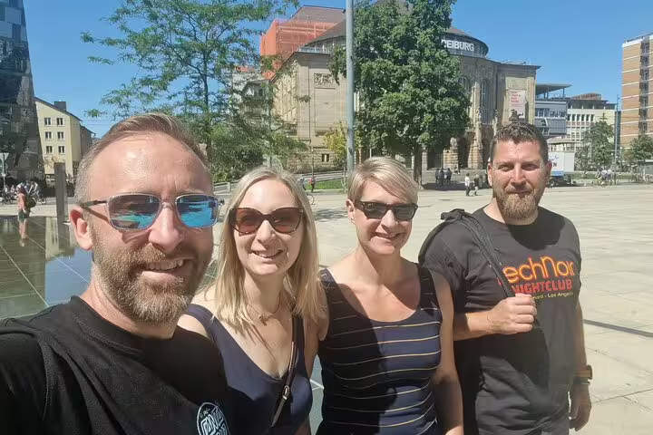 Group selfie at Freiburg city square, starting a self-guided scavenger hunt and sights tour in Breisgau