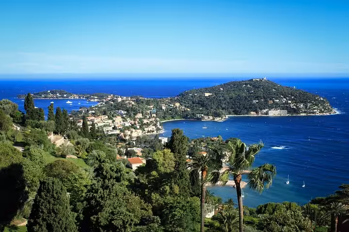Scenic coastal view of the French Riviera, showcasing vibrant blue waters and lush greenery in Monte-Carlo.