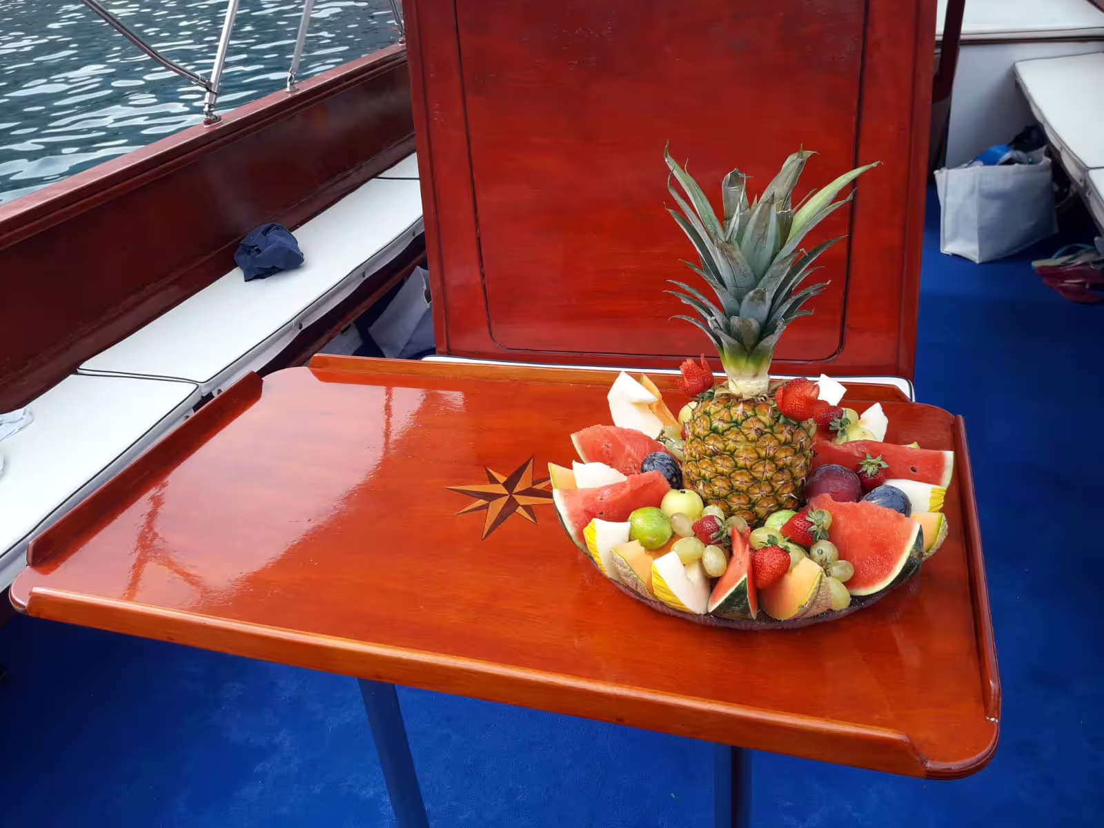 Fresh fruit platter on board during a private Taormina boat tour, perfect for a relaxing Sicily sea cruise