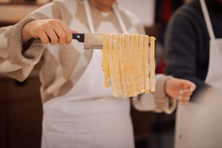Close-up of freshly cut fettuccine pasta prepared in a Rome Piazza Navona cooking class.