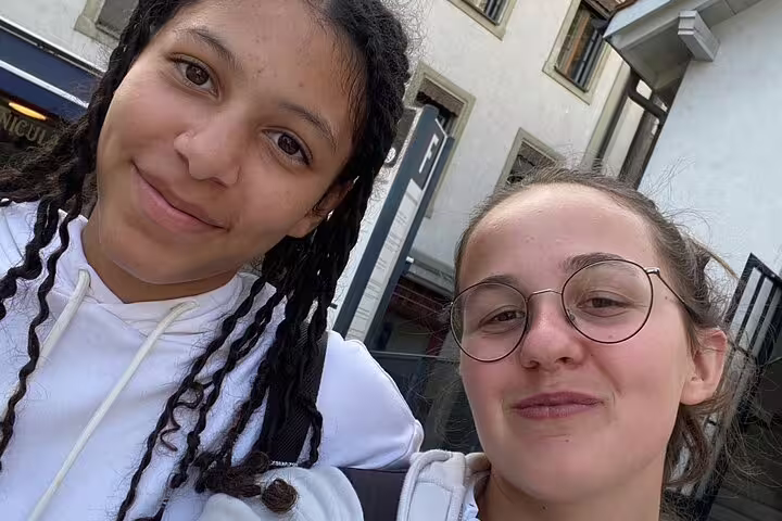 Friends selfie on a Fribourg self-guided scavenger hunt tour, exploring historic streets and landmarks