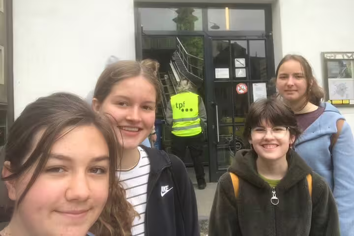 Friends at Fribourg starting point for a self-guided scavenger hunt tour, ready to explore city sights