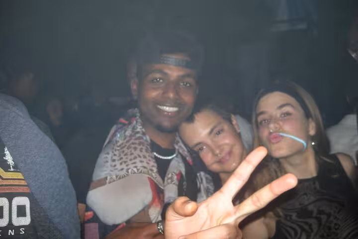 Group of friends enjoying a lively night out in a Barcelona club, capturing the essence of vibrant nightlife.