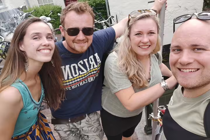 Group of friends smiling on a Copenhagen e-scavenger hunt, self-paced walking tour with mobile clues