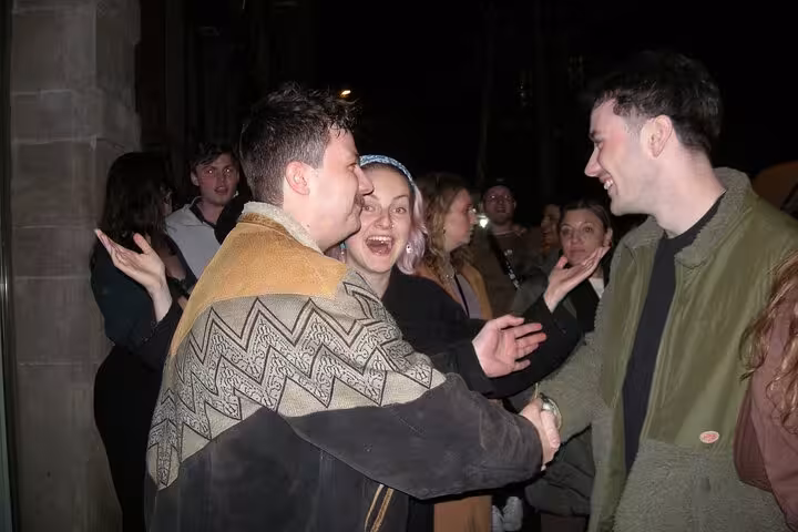 Group of friends enjoying a lively night out in Barcelona, embodying the vibrant nightlife experience.