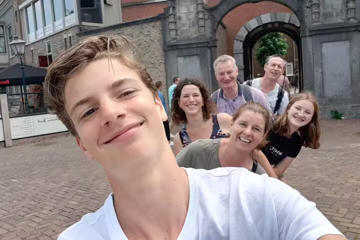 Friends take a selfie during an e-scavenger hunt in Montpellier old town, exploring landmarks at their own pace