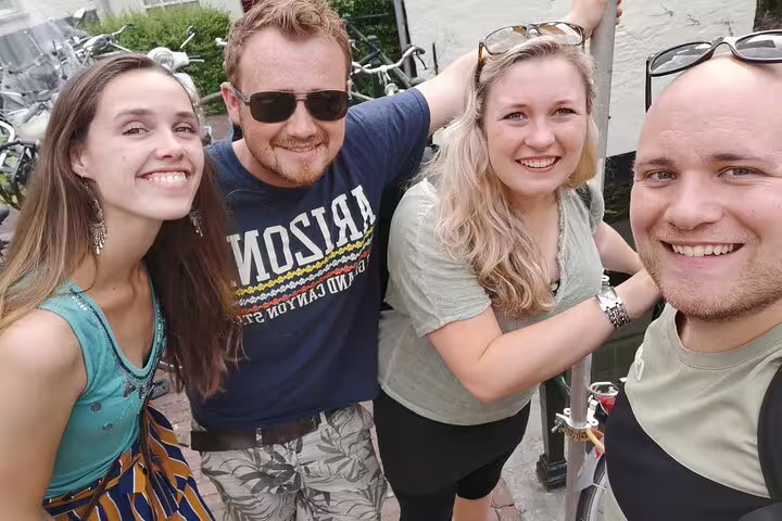 Friends take a selfie during an e-scavenger hunt in Madrid, exploring the city at their own pace