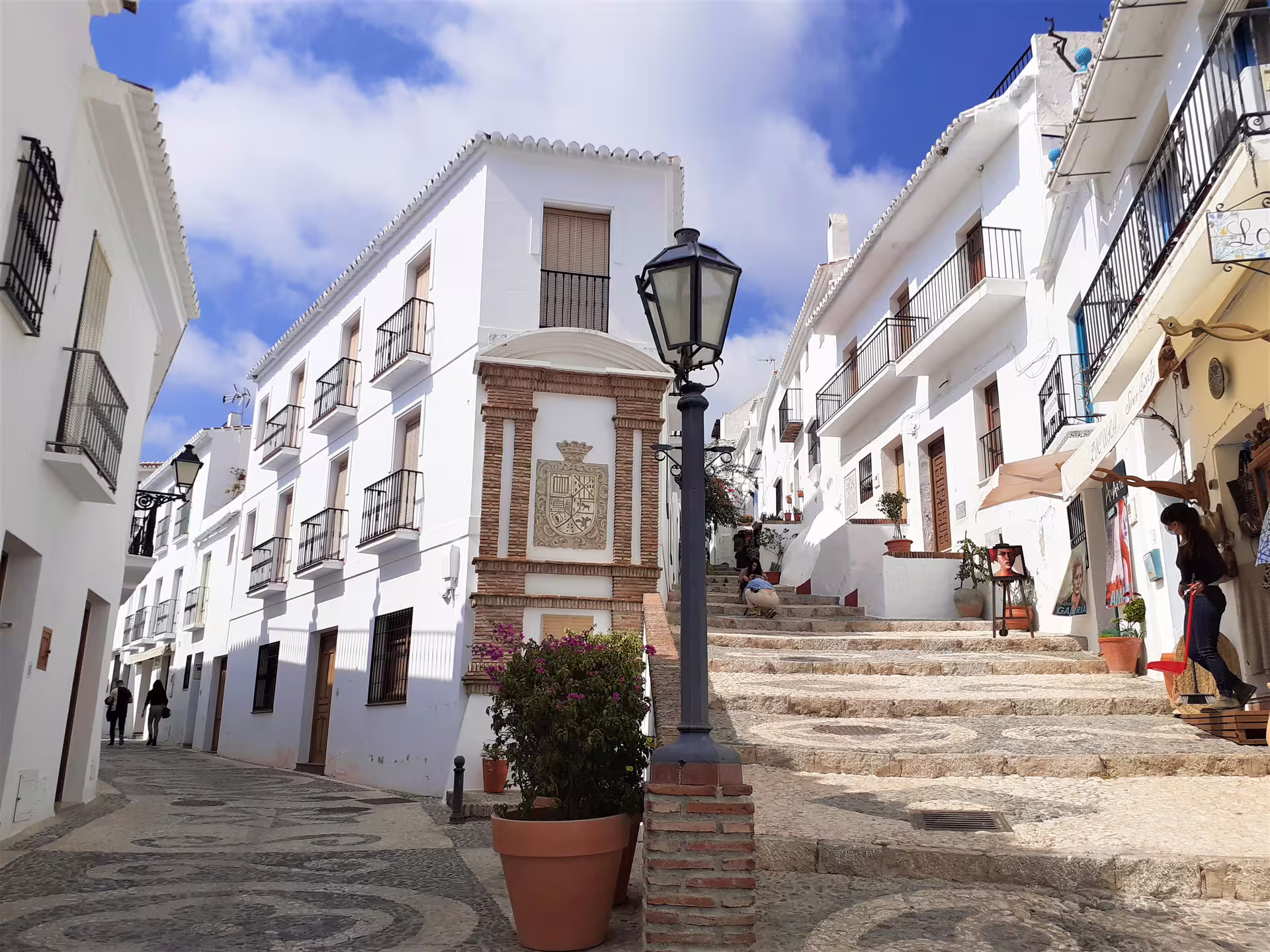 Whitewashed steps and balconies in Frigiliana old town on private day trip from Marbella with pickup