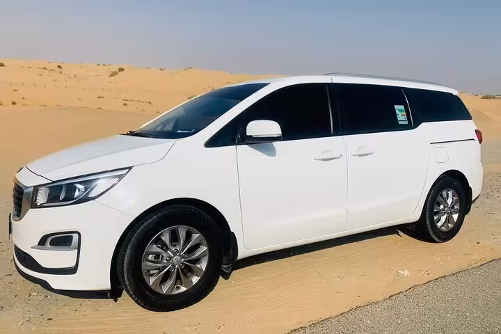 Comfortable white MPV for Fujairah Dibba Khorfakan to Dubai Airports transfer with door-to-door service