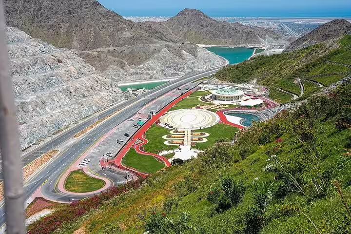 Experience Fujairah's scenic mountain roads and vibrant landscapes on a private Dubai tour exploring nature and heritage.