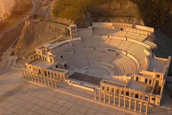 Majestic Roman-style amphitheater in Fujairah, bathed in golden sunset light, showcasing cultural heritage beauty.