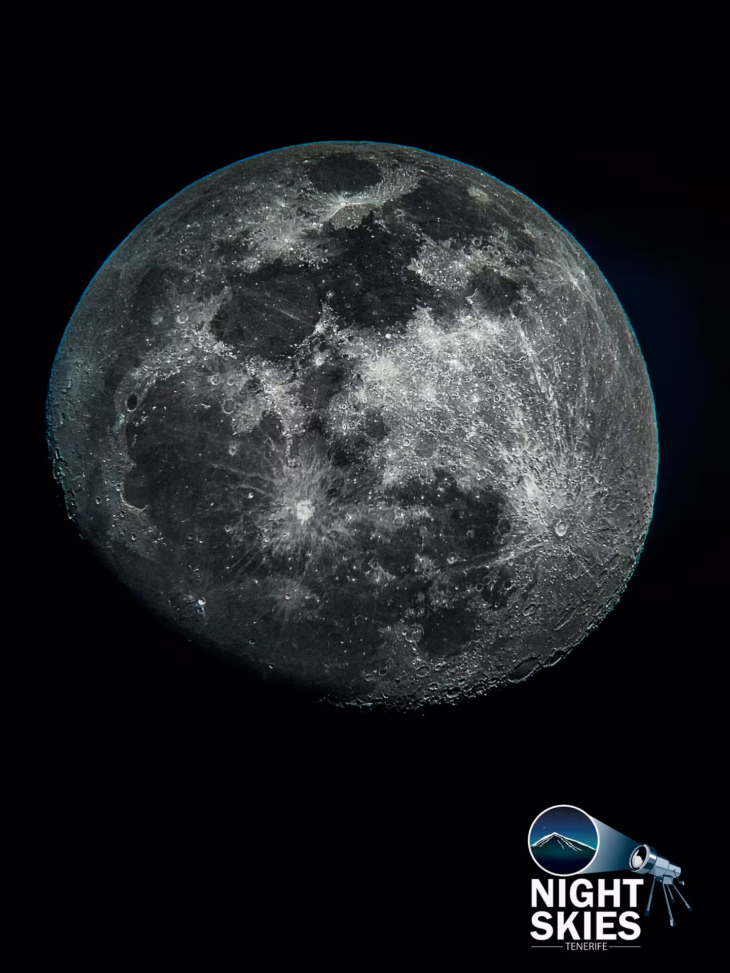 Close-up of a full moon in the night sky, showcasing detailed lunar surface textures during Tenerife's stargazing tour.
