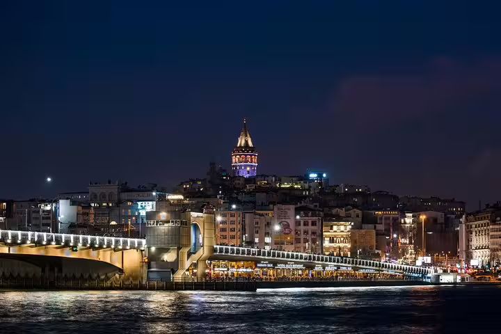 Galata Bridge and Galata Tower glowing at night over the Golden Horn on a private Istanbul by night tour