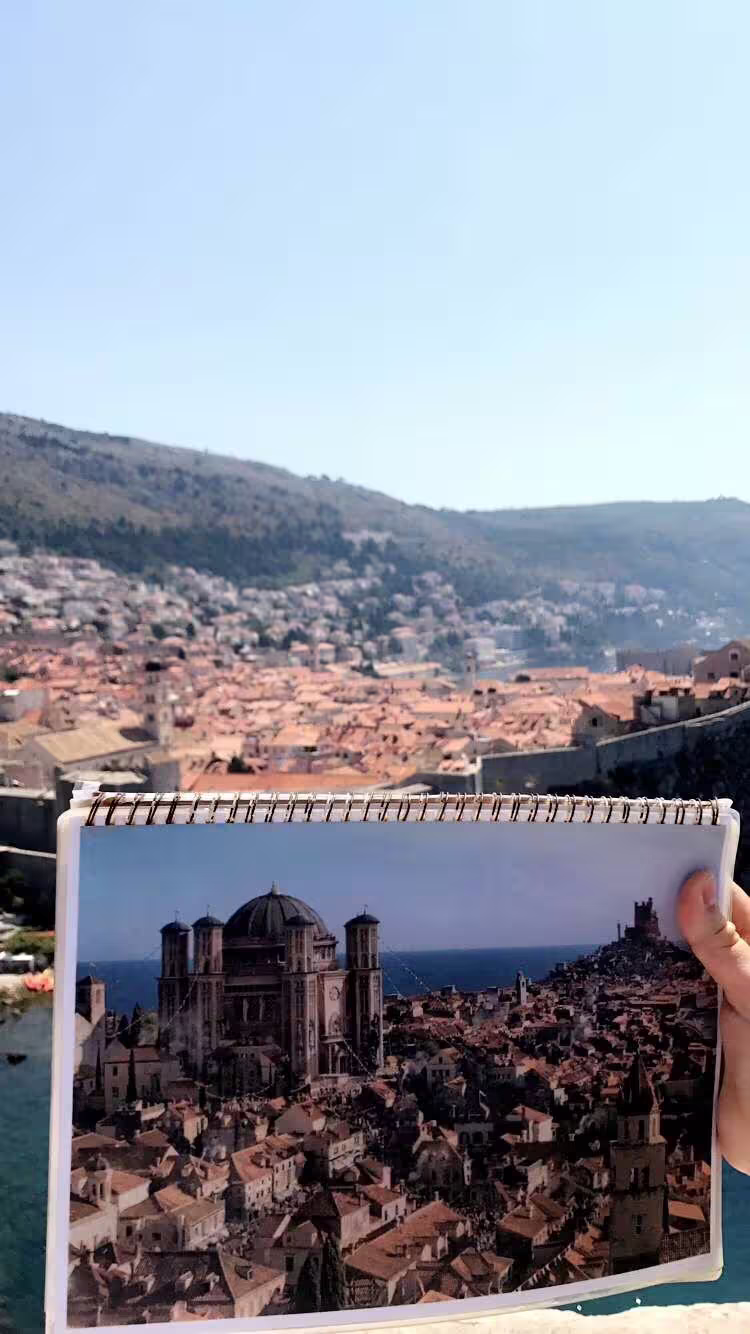 Guide shows Game of Thrones scene photo against Dubrovnik Old Town view on 3-hour Lokrum tour