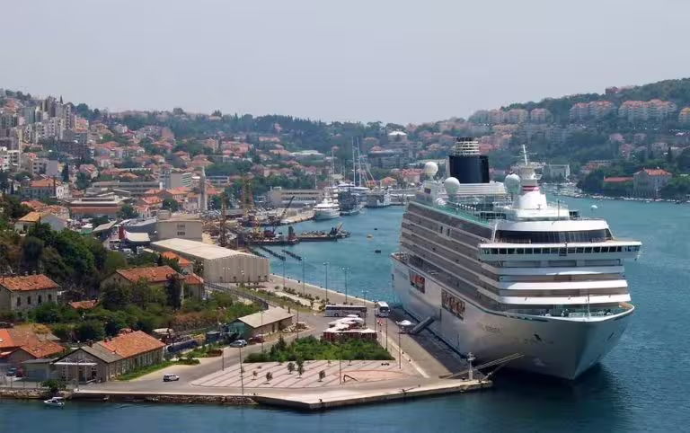 Cruise ship docked at Dubrovnik port, starting point for Total Game of Thrones shore excursion to Old Town
