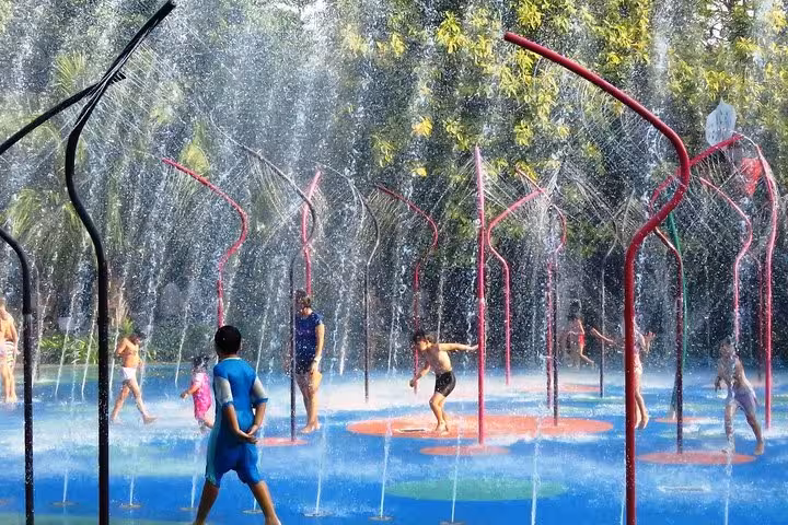 Children playing in water spray park at Gardens by the Bay Singapore, family-friendly attraction with e-ticket