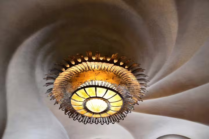 Intricate chandelier inside Casa Batlló, highlighting Gaudi's architectural artistry and organic design.