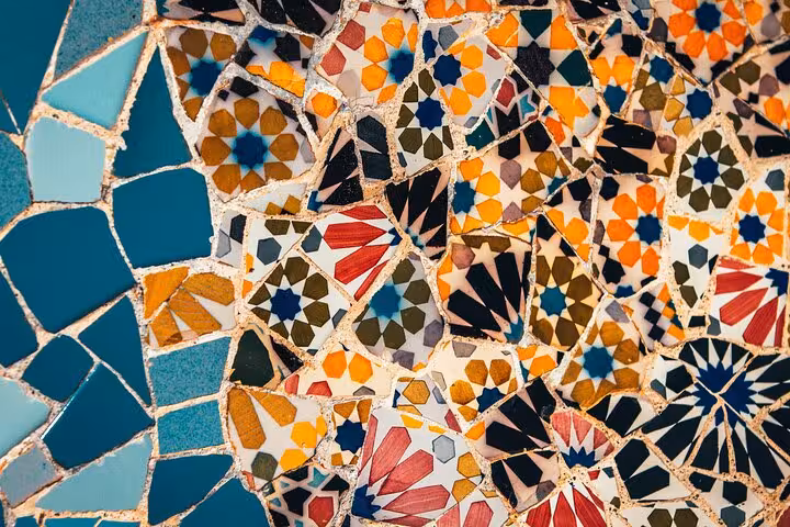 Colorful Gaudí-style mosaic tiles in Barcelona, a highlight of the Gràcia Catalan culture and cuisine small group tour