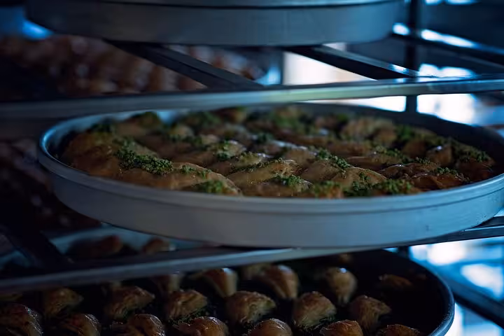 Trays of pistachio baklava in a Gaziantep pastry shop, featured on a private all-inclusive guided city tour