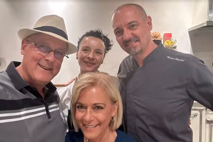 Participants enjoying a friendly moment during the gelato and biscotti workshop in Florence.