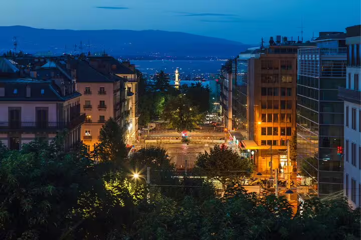 Evening view over central Geneva to Lake Geneva, ideal clue location on a self-guided scavenger hunt