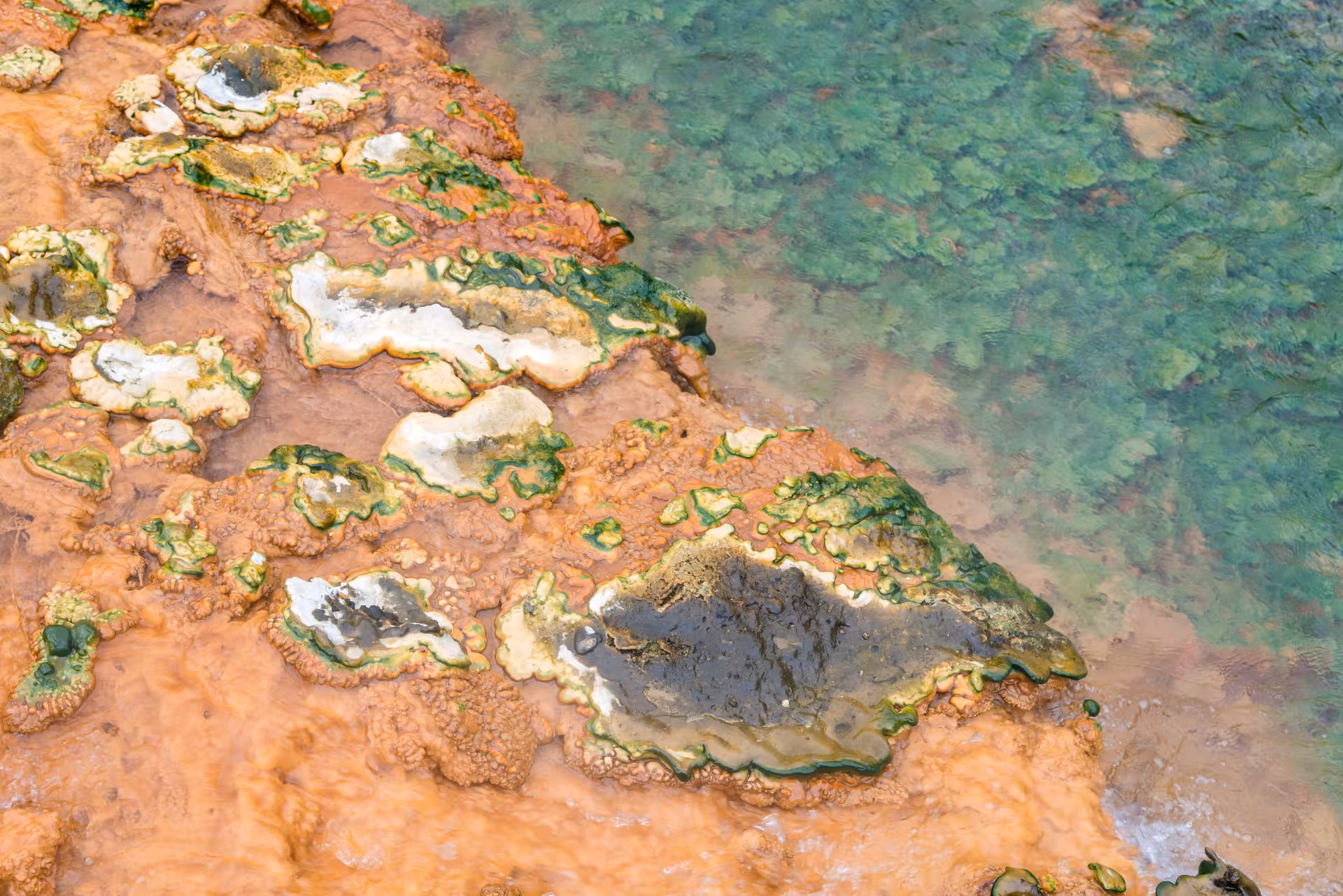 Colorful geothermal mineral pools in Grændalur valley on a private Reykjadalur and Grændalur circle hike, Iceland